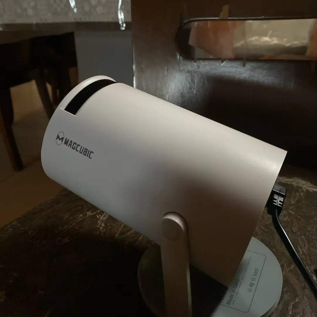 Mini portable projector home theater setup with a 130-inch screen, perfect for streaming movies, gaming, and outdoor cinema experiences.